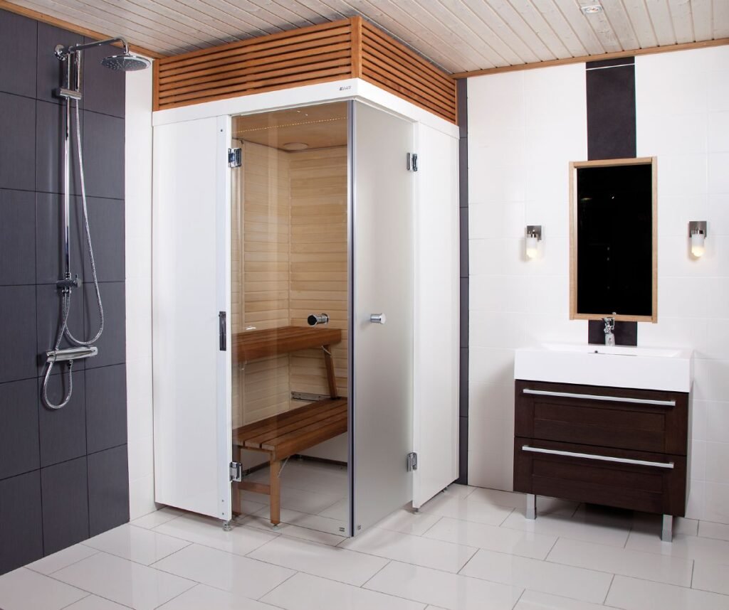a compact sauna with closed doors in a bathroom next to shower and dressing