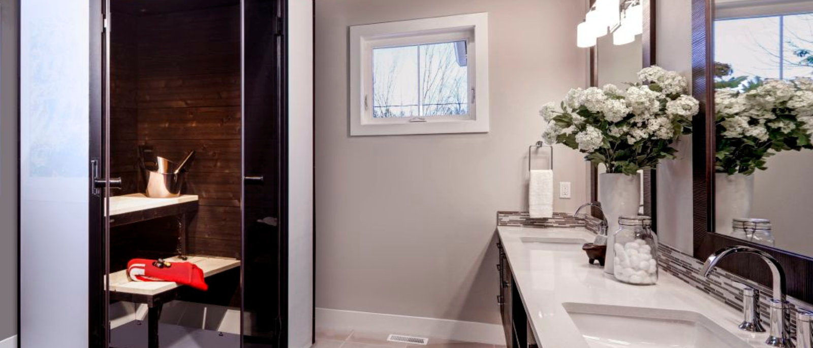 a compact black and grey bathroom sauna in a luxurious bathroom setting